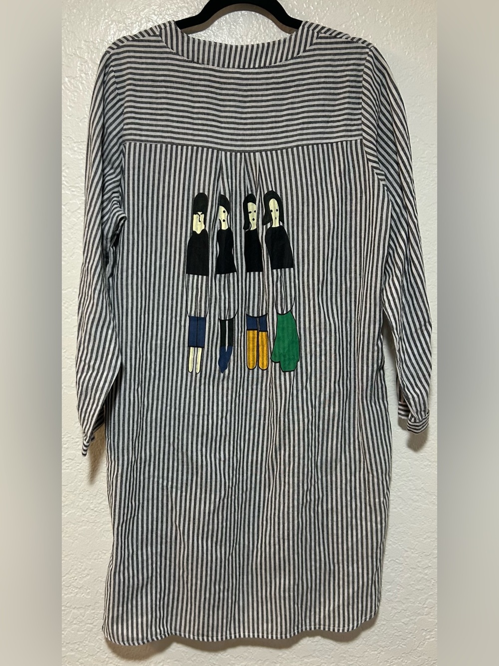 Grey and White Striped Long Sleeve Dress with Black Haired Ladies with Pockets